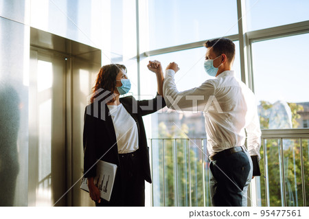 Elbow greeting to avoid the spread of coronavirus. COVID-19. 95477561