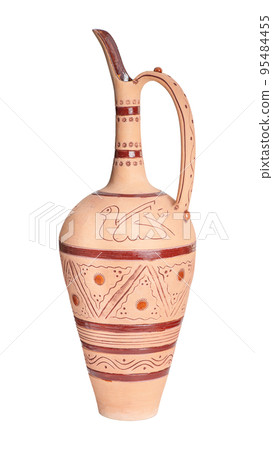 A vintage decorated ceramic jug isolated on a white background 95484455