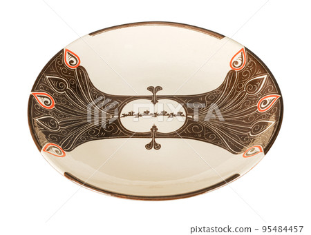 A vintage oriental ceramic plate isolated on a white background 95484457