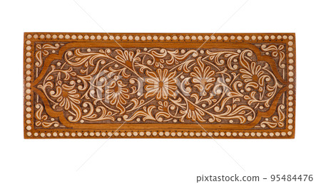 A wooden carved ornament isolated on a white background A wooden carved ornament isolated on a white background 95484476