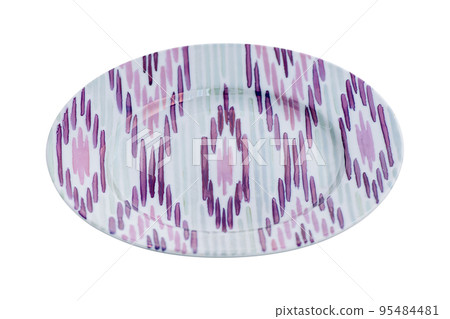 A vintage oriental ceramic plate isolated on a white background A vintage oriental ceramic plate isolated on a white background 95484481
