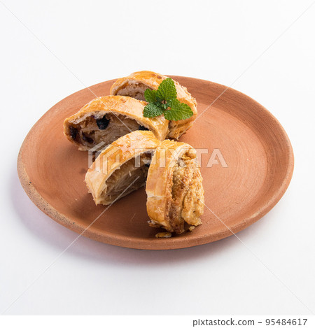 A beautiful shot of tasty sweet rolls with walnuts, raisins and sugar 95484617