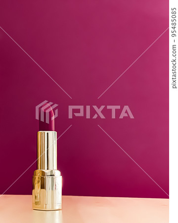 Purple lipstick in golden tube on colour background, luxury make-up and cosmetics for beauty brand product design concept Purple lipstick in golden tube on colour background, luxury make-up and cosmetics for beauty brand product design concept 95485085