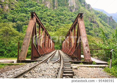 Railroad to the ancient Inca ruins in the sky and Machu Picchu ruins Railroad to the ancient Inca ruins in the sky and Machu Picchu ruins 95486591