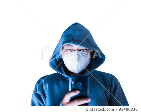 Asian man in hoodie and mask hacking Something from a mobile phone intended to take blurry photos in a white background. There is a clipping path. Asian man in hoodie and mask hacking Something from a mobile phone intended to take blurry photos in a white background. There is a clipping path. 95486830