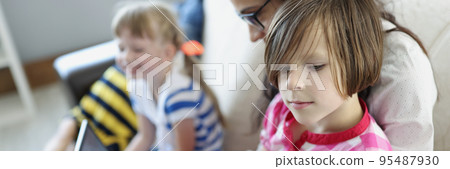 Happy mum and kid spend weekend together at home, mother entertain children Happy mum and kid spend weekend together at home, mother entertain children 95487930