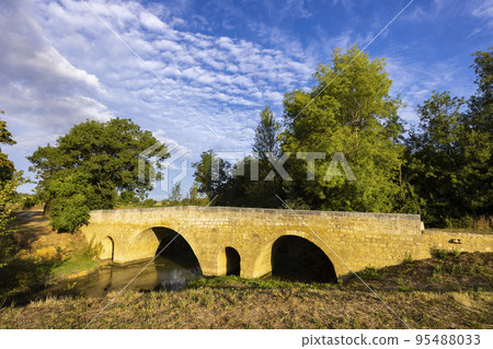 Romanesque bridge of Artigue and river Osse near Larressingle on route to Santiago de Compostela, UNESCO World Heritage Site, departement Gers, France Romanesque bridge of Artigue and river Osse near Larressingle on route to Santiago de Compostela, UNESCO World Heritage Site, departement Gers, France 95488033