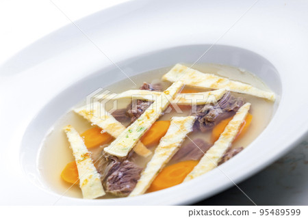 beef soup with celestine noodles and carrot 95489599