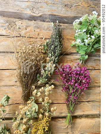 Dried medicinal flowers and herbs on wooden background. Studio Photo Dried medicinal flowers and herbs on wooden background. Studio Photo 95492012