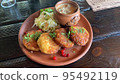 Potato pancakes with sauce, sauerkraut. Studio Photo 95492119