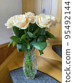 Bouquet of fresh roses in crystal vase. Studio Photo 95492144