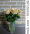 Bouquet of fresh roses in crystal vase. Studio Photo 95492146