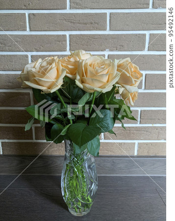Bouquet of fresh roses in crystal vase. Studio Photo 95492146