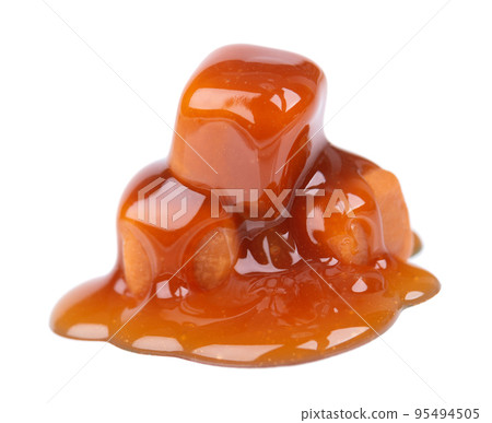 Sweet caramel candies and sauce, isolated on white background. Delicious caramel. Sweet caramel candies and sauce, isolated on white background. Delicious caramel. 95494505