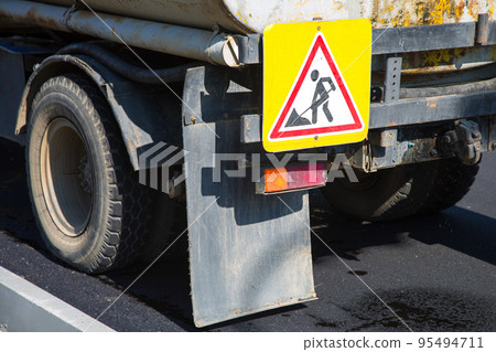 Repair vehicle with signs fixed on board - repair work Repair vehicle with signs fixed on board - repair work 95494711