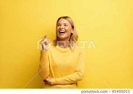 Happy Woman Laughing Isolated on Yellow. Young Girl Laughing Out Loud by Joke 95495053