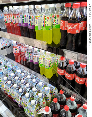 JOHOR, MALAYSIA -MARCH 1, 2022: Soft drinks or carbonated drinks displayed for sale in the supermarket. Have a price tag to make it easier for customers to buy. JOHOR, MALAYSIA -MARCH 1, 2022: Soft drinks or carbonated drinks displayed for sale in the supermarket. Have a price tag to make it easier for customers to buy. 95495637