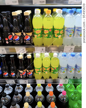 JOHOR, MALAYSIA -MARCH 1, 2022: Soft drinks or carbonated drinks displayed for sale in the supermarket. Have a price tag to make it easier for customers to buy. JOHOR, MALAYSIA -MARCH 1, 2022: Soft drinks or carbonated drinks displayed for sale in the supermarket. Have a price tag to make it easier for customers to buy. 95495639