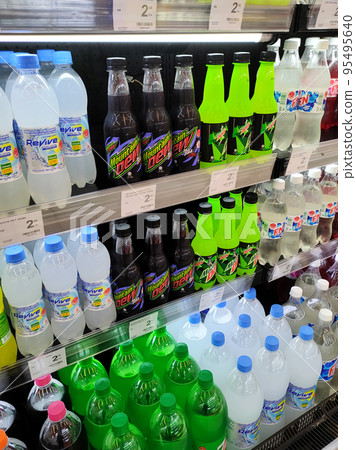 JOHOR, MALAYSIA -MARCH 1, 2022: Soft drinks or carbonated drinks displayed for sale in the supermarket. Have a price tag to make it easier for customers to buy. JOHOR, MALAYSIA -MARCH 1, 2022: Soft drinks or carbonated drinks displayed for sale in the supermarket. Have a price tag to make it easier for customers to buy. 95495640