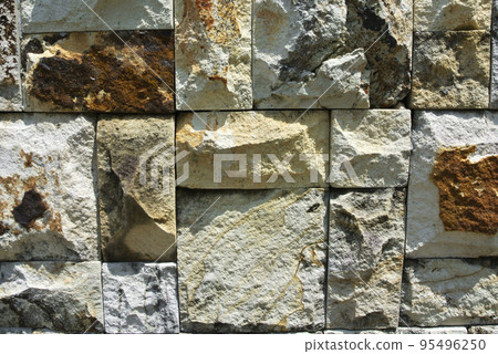 Artificial stone cladding. Designed to resemble real stone. Arranged vertically and attached to the wall with a special adhesive. Used as decoration on the walls of buildings. 95496250