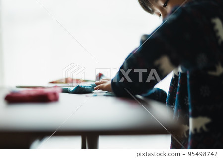 Children playing with clay 95498742