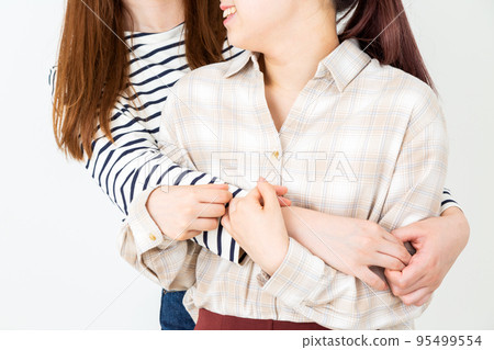 Young female college student hugging with a smile 95499554