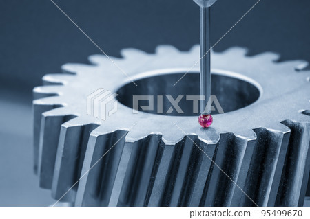 The  CMM machine measuring the metal gear parts . 95499670