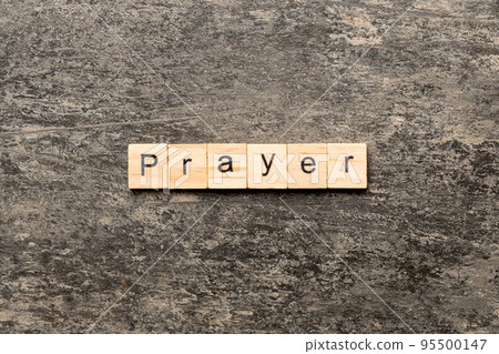PRAYER word written on wood block. PRAYER text on cement table for your desing, concept 95500147