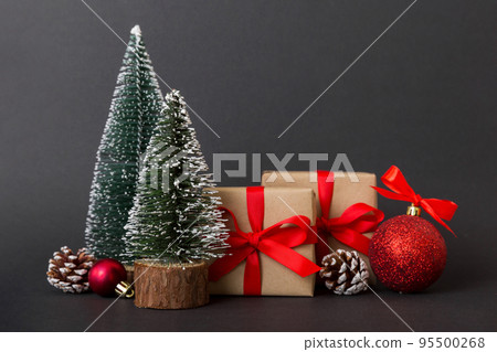 Christmas composition. Gifts, small tree, branches and craft DIY decorations on white background. New year concept. Christmas home decoration Flat lay, top view, copy space 95500268