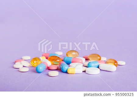 Many different colorful medication and pills perspective view. Set of many pills on colored background 95500325