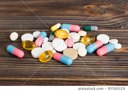 Collection Of Various Medical Tablets And Pills. Assorted pharmaceutical medicine pills, tablets and capsules on table background. Heap of assorted various medicine tablets. Health care 95500329