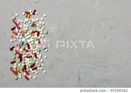 Protective face masks or surgical masks, medicine pills and thermometer on table background. Coronavirus disease. Corona virus concept. Space for text 95500562