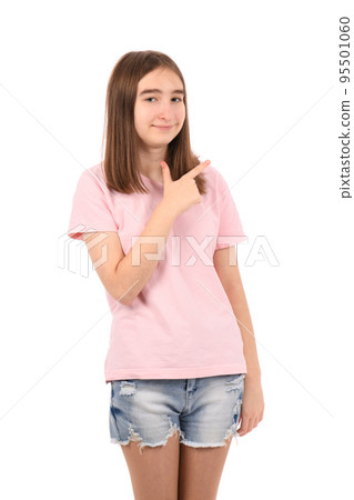 Young beautiful girl in a pink t-shirt and denim shorts on a white background Young beautiful girl in a pink t-shirt and denim shorts on a white background 95501060