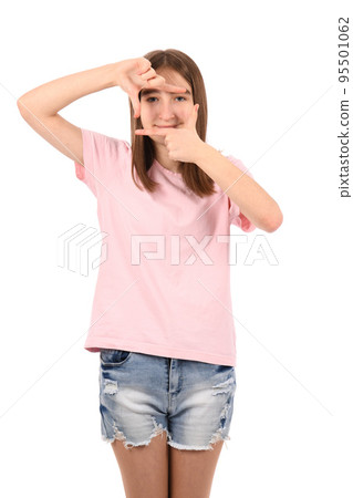 Young beautiful girl in a pink t-shirt and denim shorts on a white background Young beautiful girl in a pink t-shirt and denim shorts on a white background 95501062