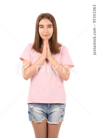 Young beautiful girl in a pink t-shirt and denim shorts on a white background Young beautiful girl in a pink t-shirt and denim shorts on a white background 95501063