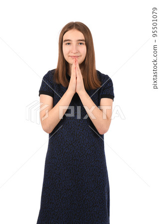 Young beautiful girl in a dark blue dress on a white background Young beautiful girl in a dark blue dress on a white background 95501079