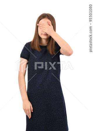 Young beautiful girl in a dark blue dress on a white background 95501080