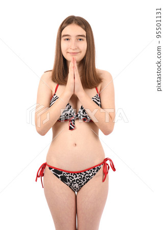 Young beautiful girl in a swimsuit on a white background 95501131