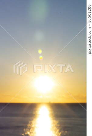 Blurred background. Sun shining in blue sky during sunset dawn. Sunrise dawning sundown. Sunny path, sunny walkway on surface of sea waves. Sunlight Sunbeams Sea landscape Natural blurry bokeh texture Blurred background. Sun shining in blue sky during sunset dawn. Sunrise dawning sundown. Sunny path, sunny walkway on surface of sea waves. Sunlight Sunbeams Sea landscape Natural blurry bokeh texture 95501206