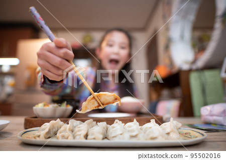 child eating dumplings child eating dumplings 95502016