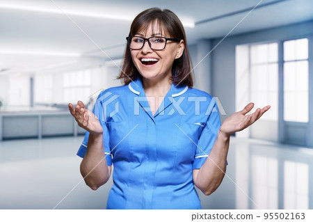 Portrait of a female nurse inside the hospital Portrait of a female nurse inside the hospital 95502163