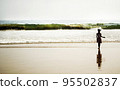 Young girl on the beach 95502837