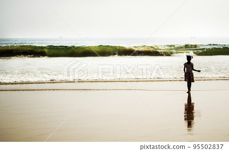 Young girl on the beach 95502837