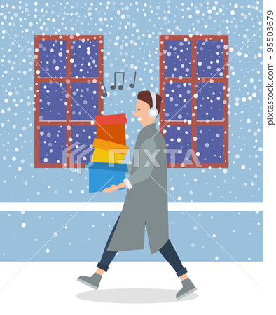 Man with shopping boxes walks on the street in winter. Guy with headphones is listening to music Man with shopping boxes walks on the street in winter. Guy with headphones is listening to music 95503679