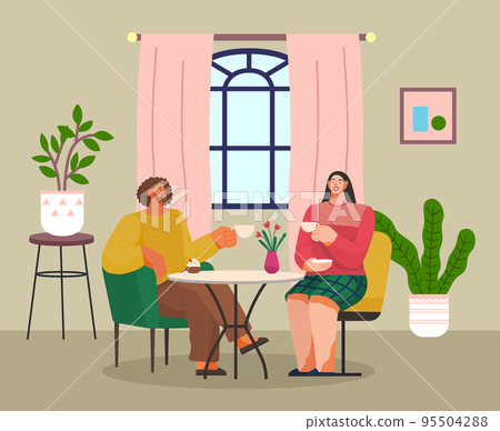 Two adult people woman and man sitting at table in cafe or home and relaxing, talking, meeting Two adult people woman and man sitting at table in cafe or home and relaxing, talking, meeting 95504288