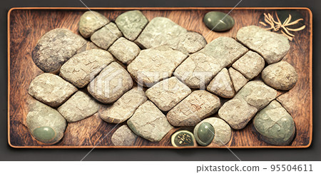 Many stones on a wooden board, wonderful rays of light fall on them. Many stones on a wooden board, wonderful rays of light fall on them. 95504611