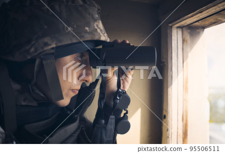 A Man with a binocular and in the military uniform. A Man with a binocular and in the military uniform. 95506511