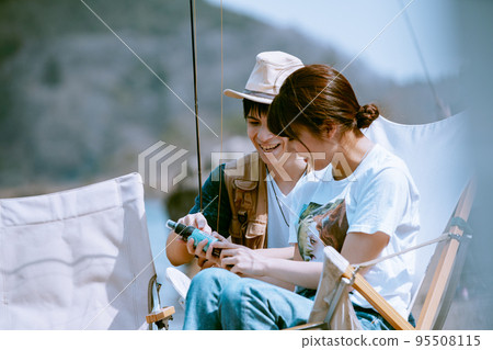 Young Japanese couple enjoying an outdoor date Young Japanese couple enjoying an outdoor date 95508115
