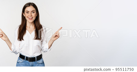 Happy smiling adult woman pointing sideways, showing two choices, products on sale logo or diagram, standing over white background 95511750