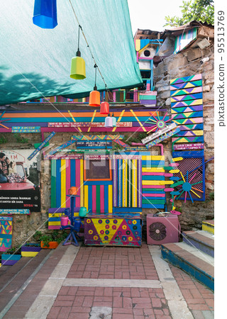 Daytime of stone cafe decorated with multicolored panels colorful stairs, and canopy in Balat District, Istanbul, Turkey Daytime of stone cafe decorated with multicolored panels colorful stairs, and canopy in Balat District, Istanbul, Turkey 95513769